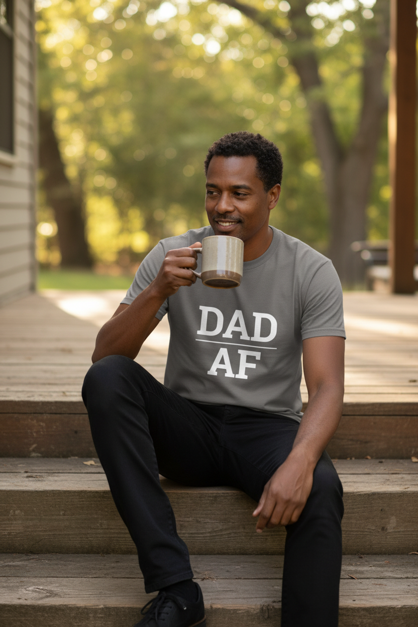 Man wearing charcoal DAD_AF t-shirt on porch with morning coffee