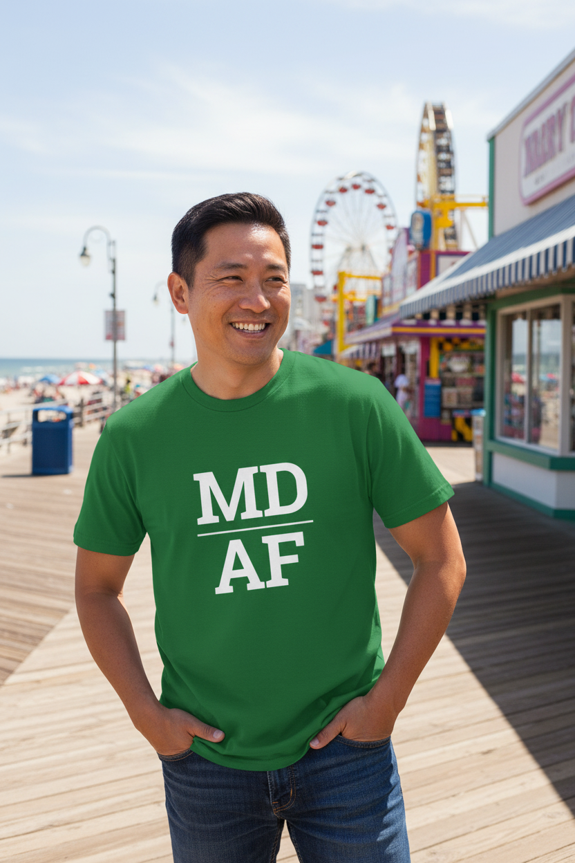Person wearing green Maryland t-shirt at Ocean City boardwalk