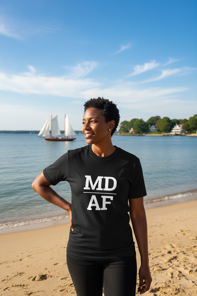 Person wearing black Maryland t-shirt at the Chesapeake Bay