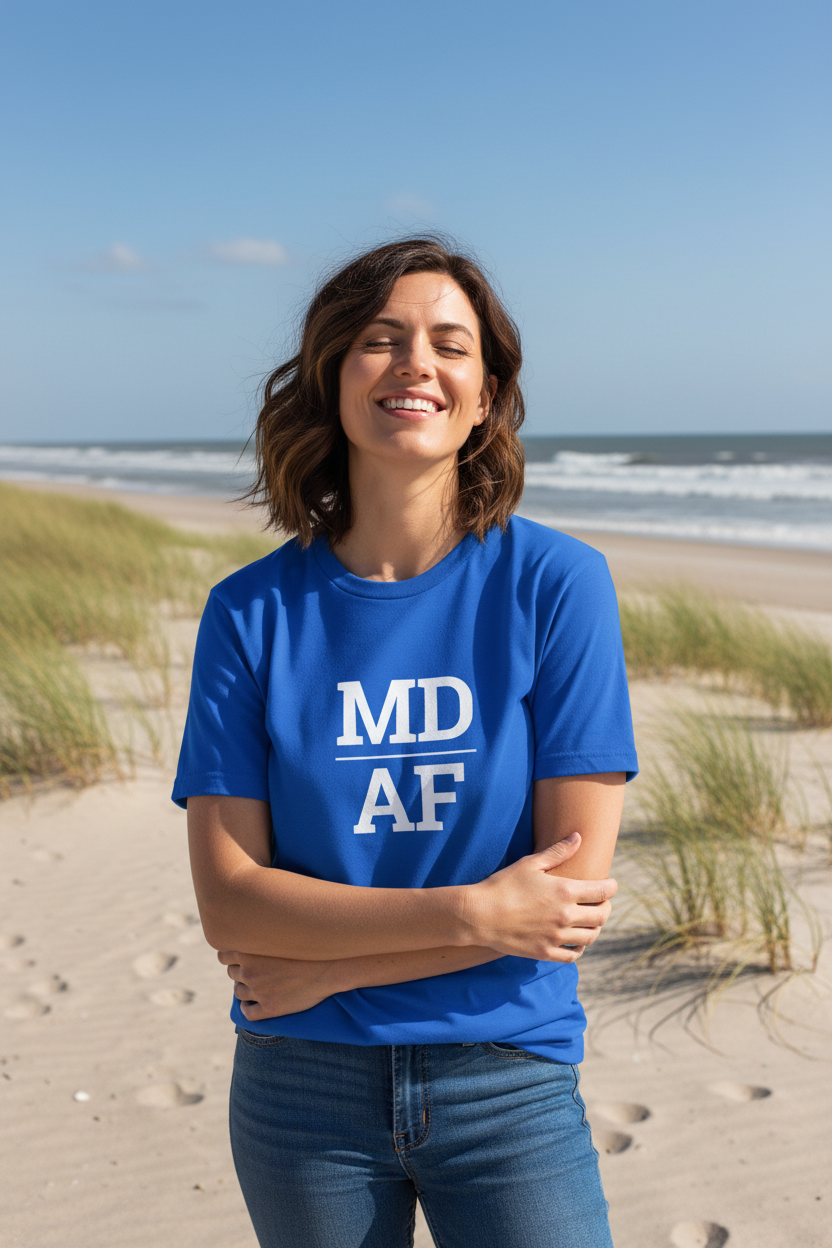 Person wearing blue Maryland t-shirt at Assateague Island beach