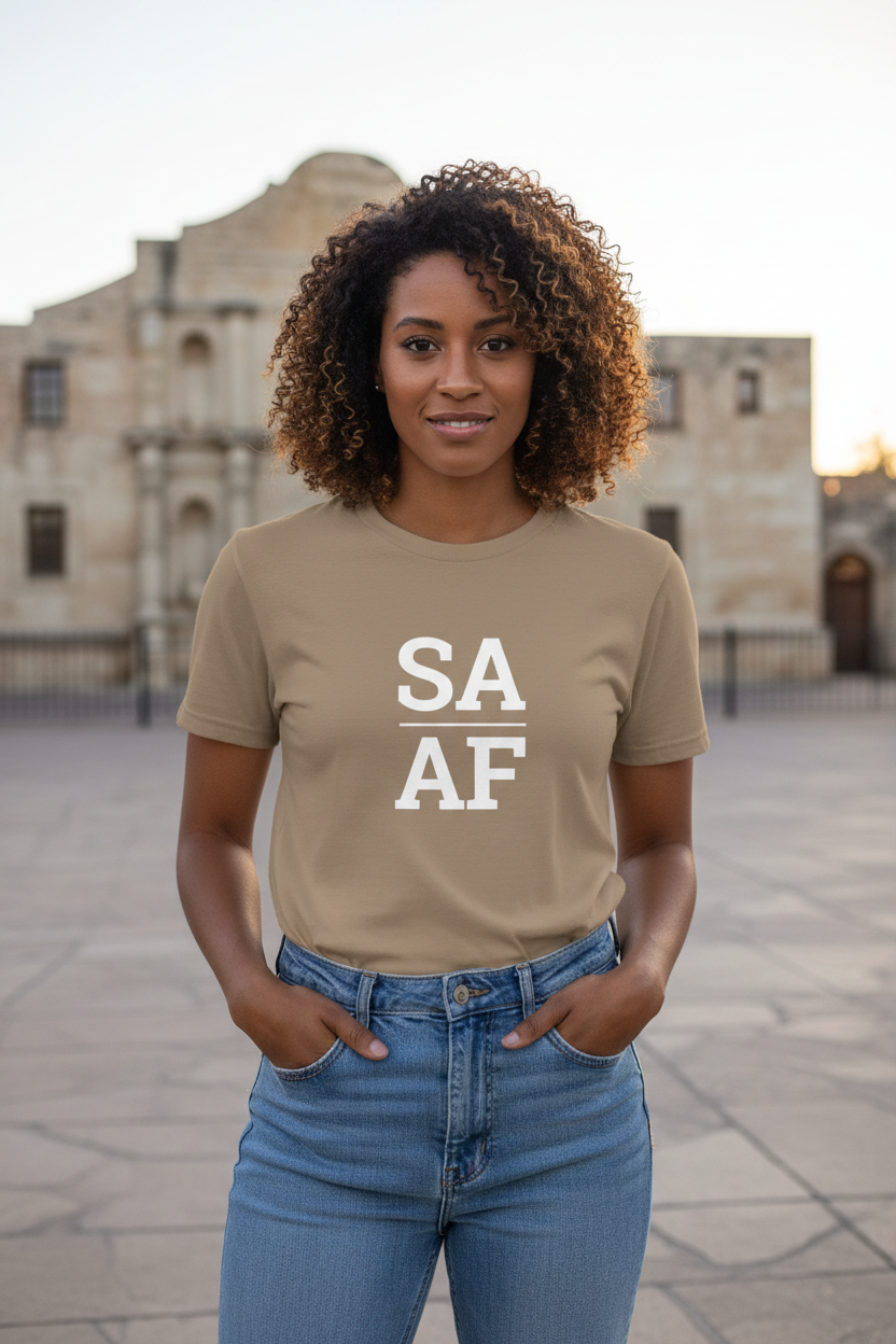 Black woman wearing brown SA_AF t-shirt at the Alamo San Antonio