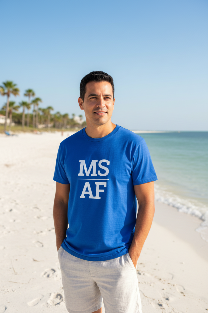 Person wearing blue Mississippi t-shirt at the Gulf Coast beach