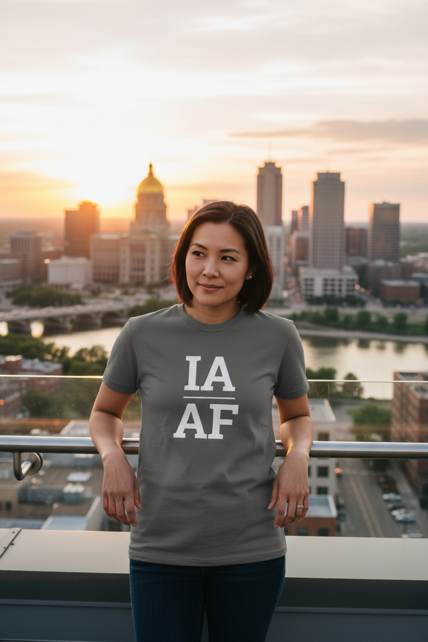 Person wearing grey Iowa t-shirt with Des Moines skyline backdrop