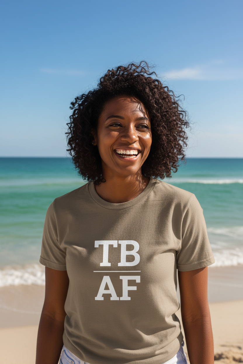 Black woman wearing brown TB_AF t-shirt at St. Pete Beach Tampa Bay