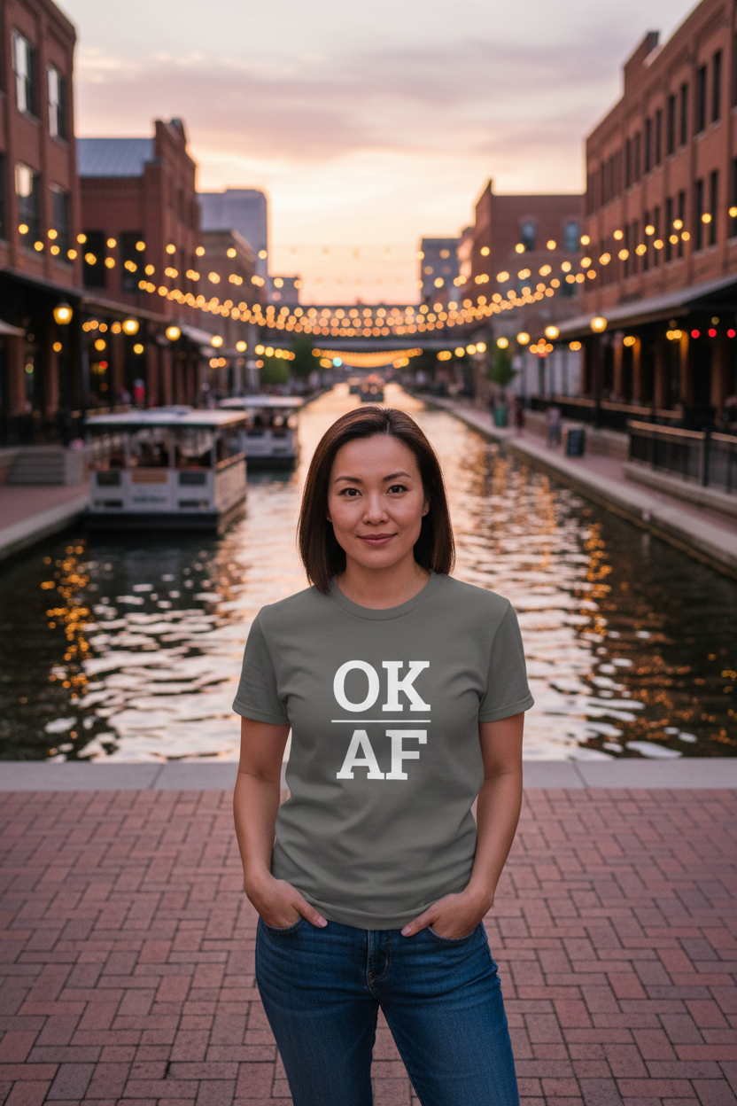 Person wearing grey Oklahoma t-shirt in Bricktown Oklahoma City