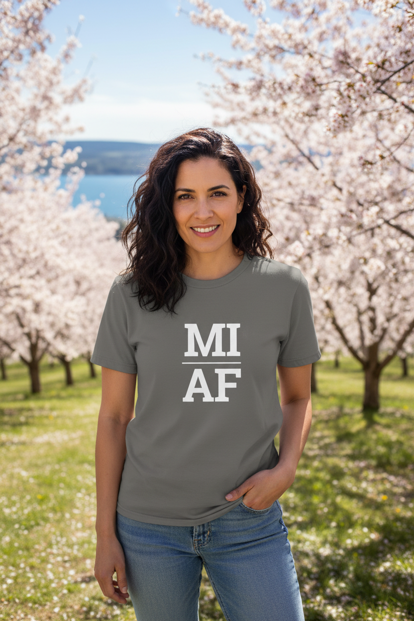 Person wearing grey Michigan t-shirt at Traverse City cherry orchards