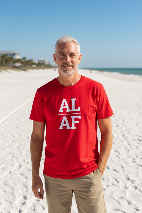 Person wearing red Alabama t-shirt at Gulf Shores beach