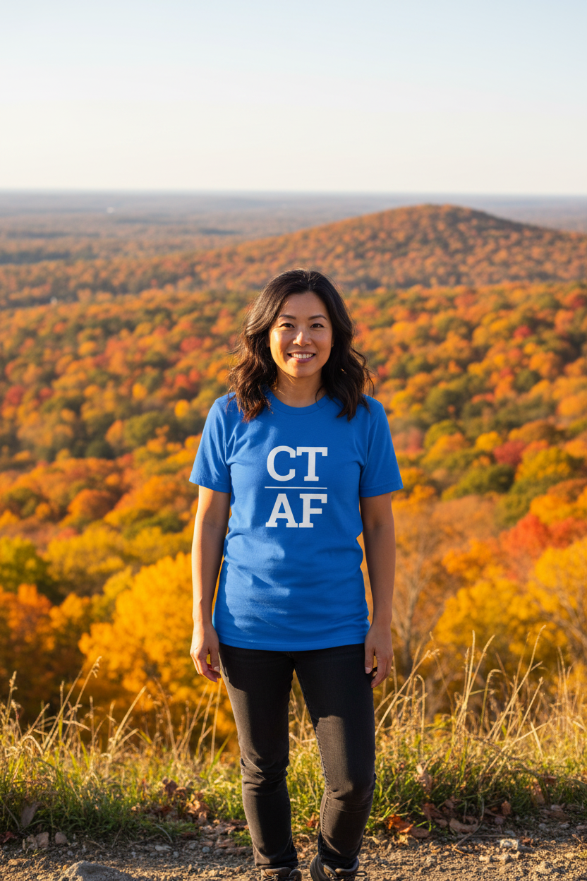 Person wearing blue Connecticut t-shirt at Sleeping Giant State Park