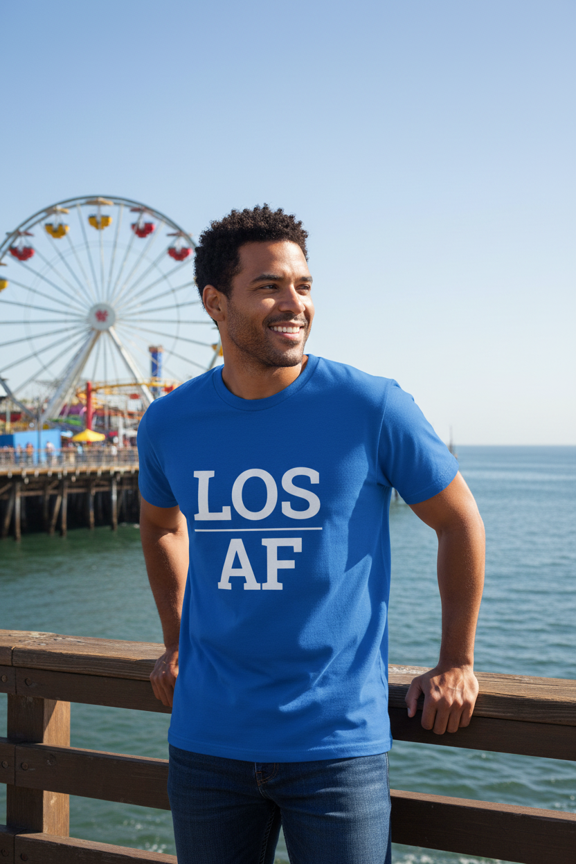 Mixed-race man wearing royal blue LOS_AF t-shirt at Santa Monica Pier Los Angeles