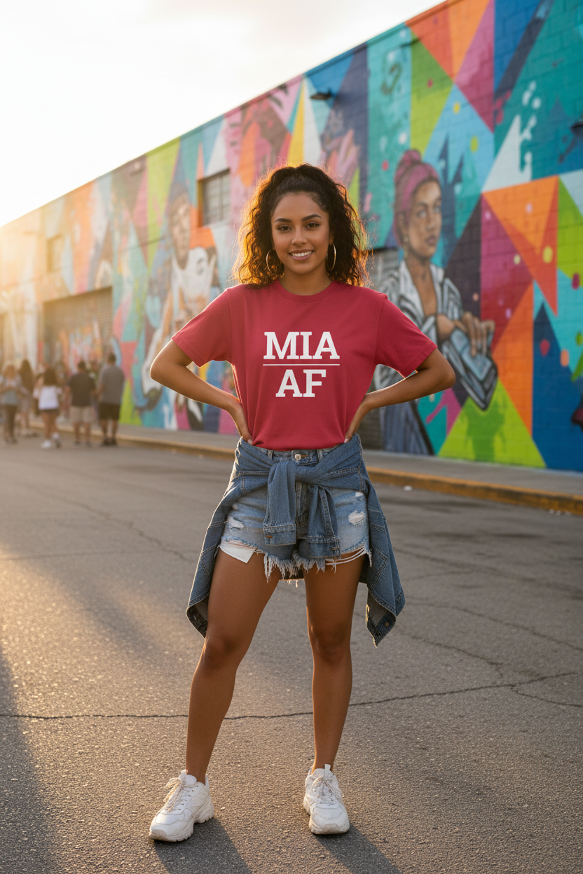 Model wearing MIA_AF cardinal red tee at Wynwood Walls in Miami, FL