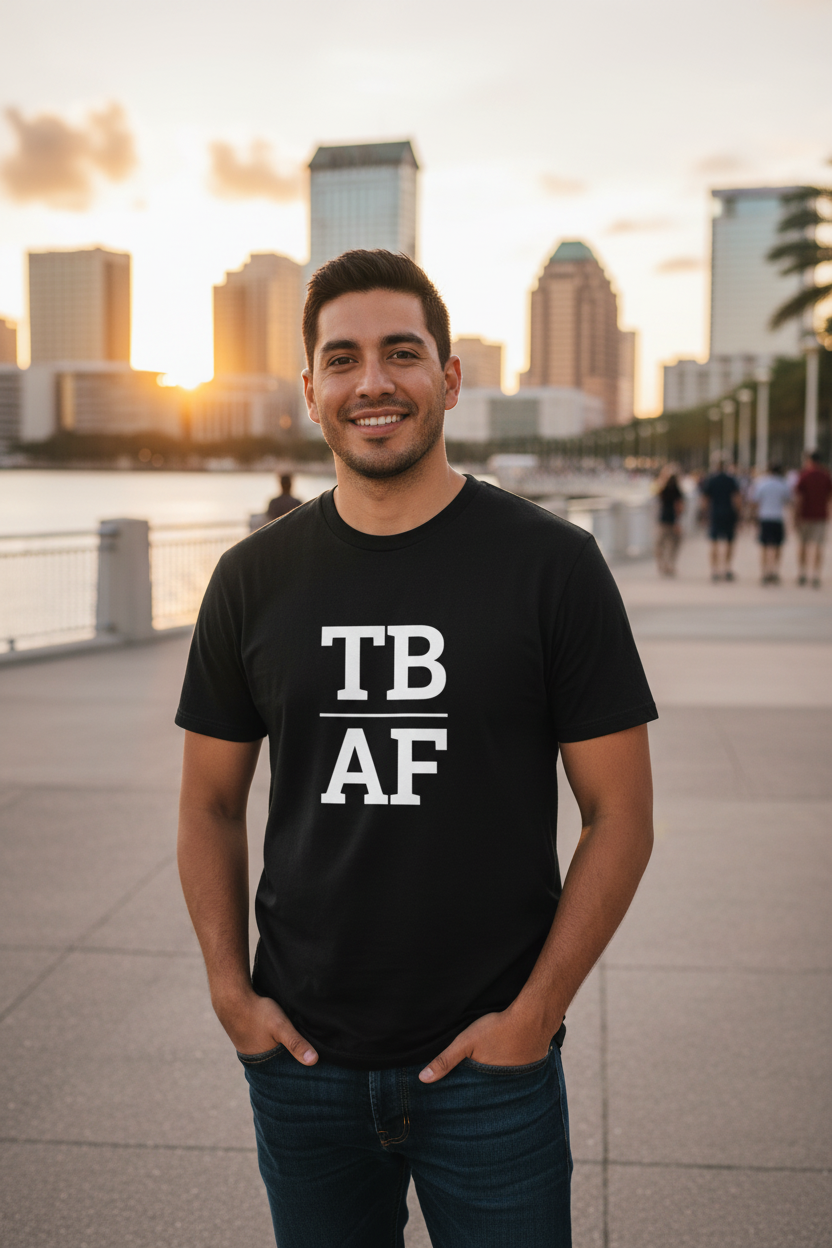 Latino man wearing black TB_AF t-shirt on Tampa Riverwalk